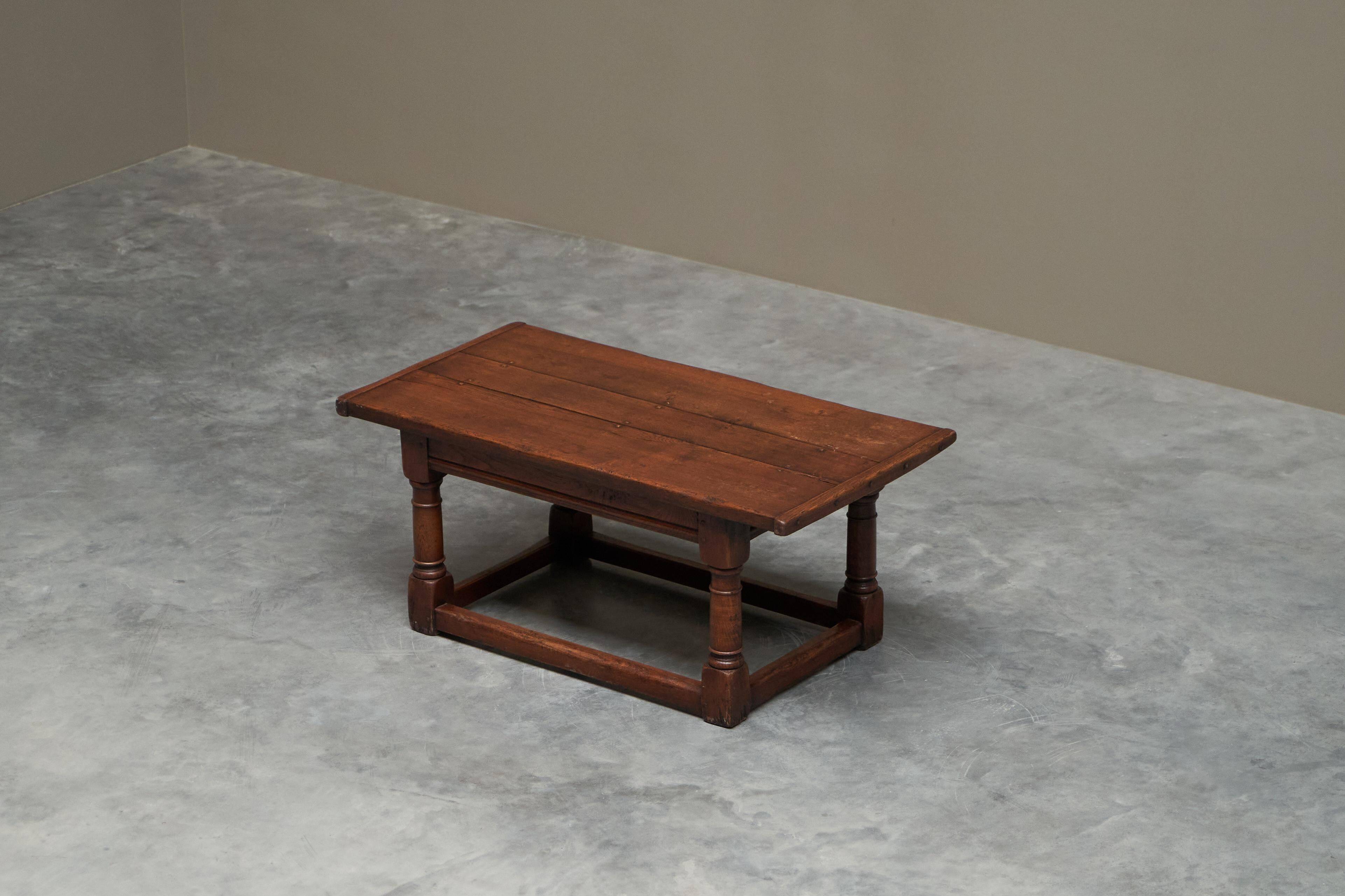 Antique solid oak coffee table in refectory style, 19th century.