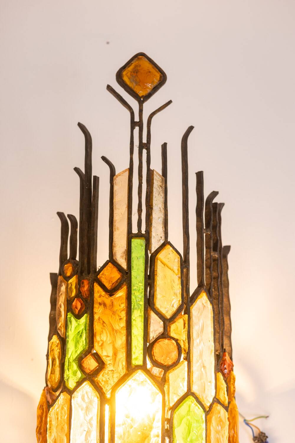 Wrought iron and colored glass wall light. 1960s.
