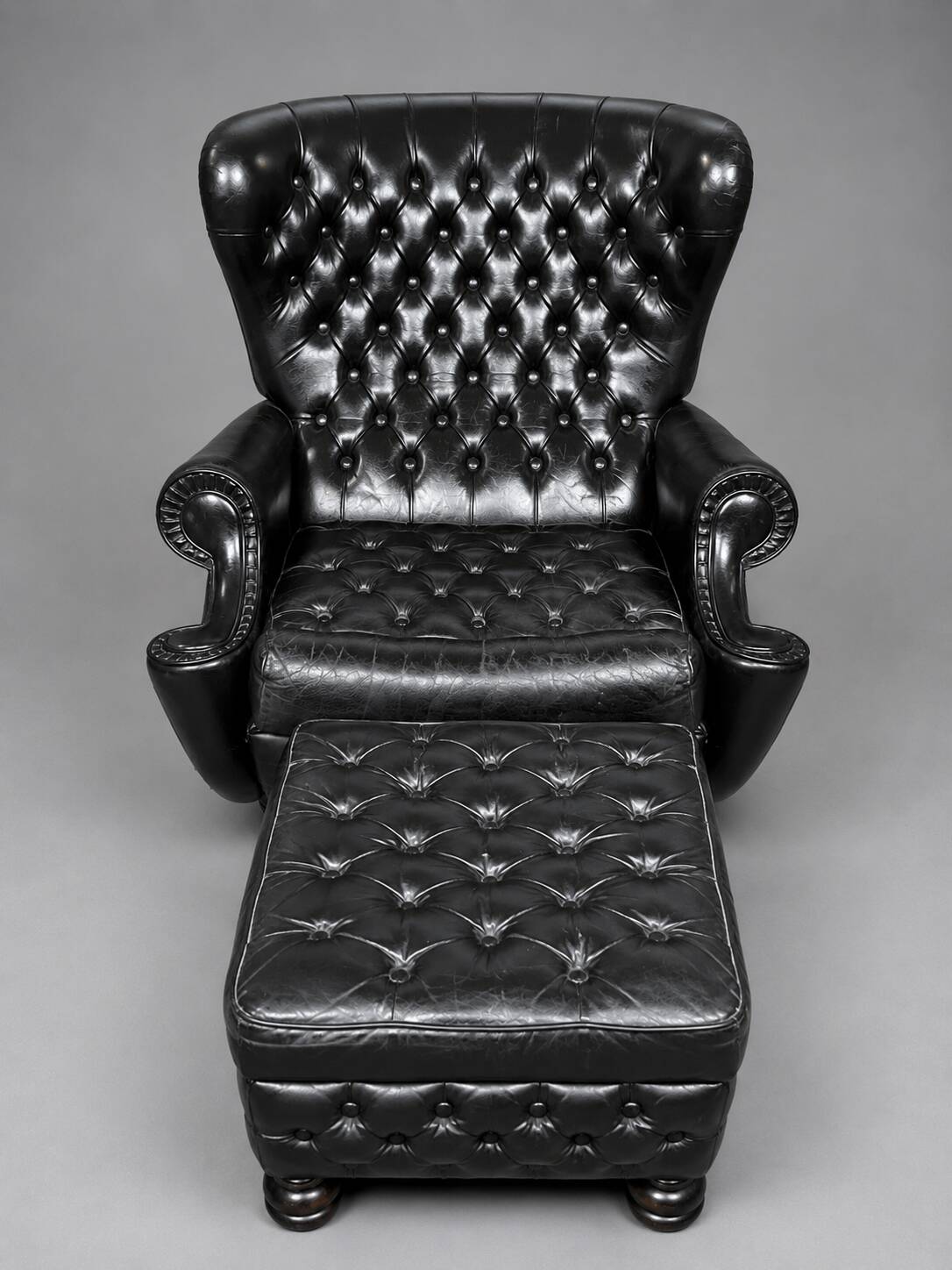 Chesterfield armchair and ottoman. Leather.