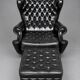 Chesterfield armchair and ottoman. Leather.