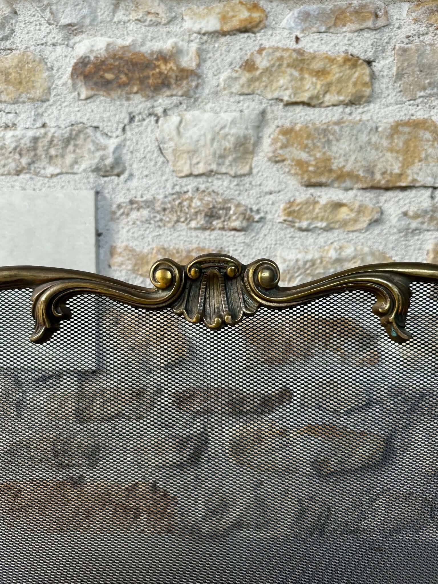 Brass fireplace screen in Louis XV style