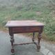 Small antique writing table in Louis XIII style made of oak.
