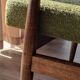 Mid-century modern armchair in olive green bouclé design by H. Lis.
