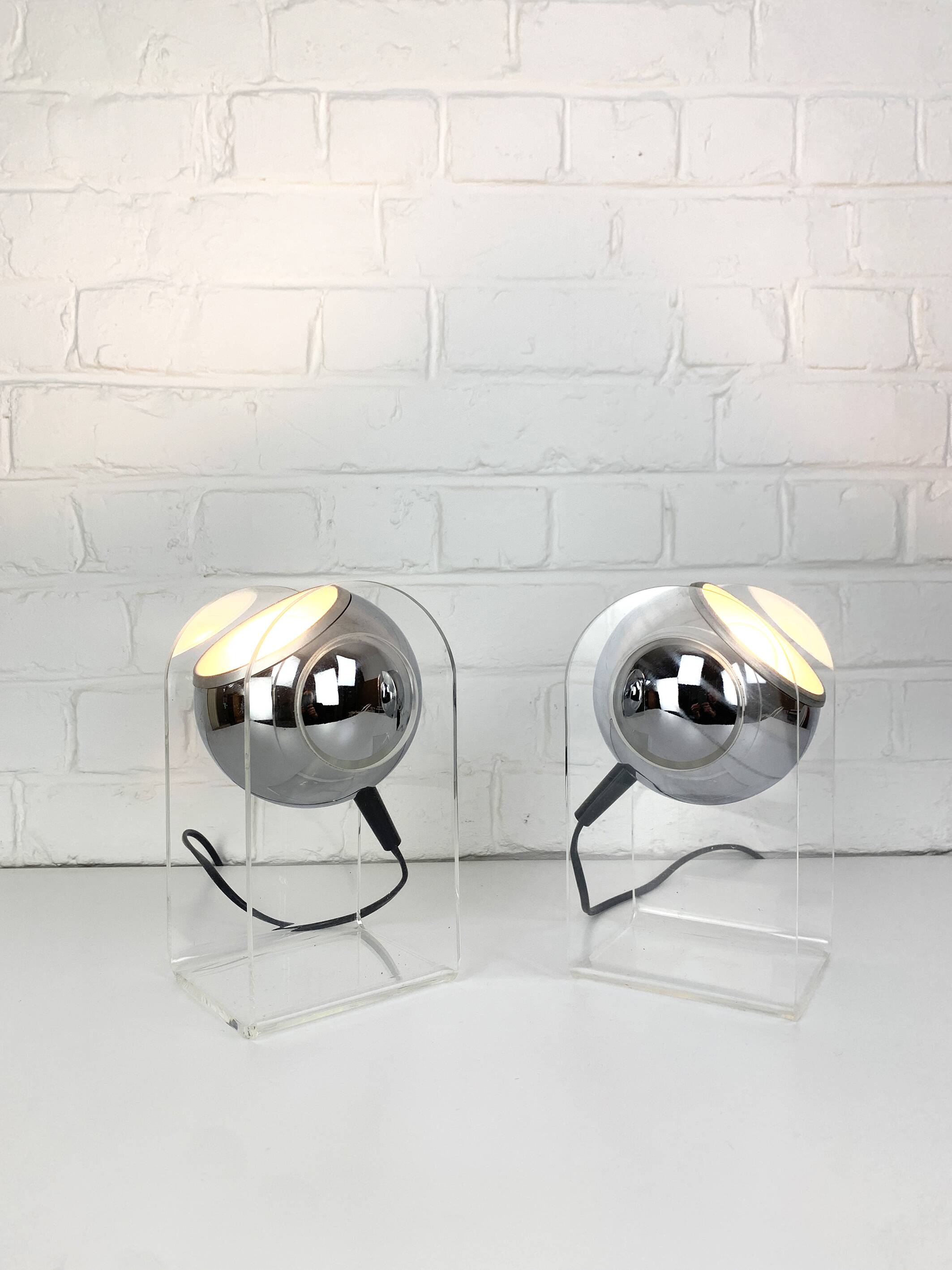 Pair of space age chrome plexiglass sphere table lamps from the 70s