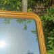 Antique Louis-Philippe mirror, gilded and patinated.