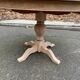 Round extendable dining table with a central pedestal base, renovated in raw wood, 150cm
