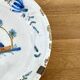 Earthenware plate with polychrome decoration - 18th century