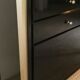 Console set and its mirror, black and gold, 80s