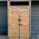 pair of old double-leaf doors with transom and carved frames