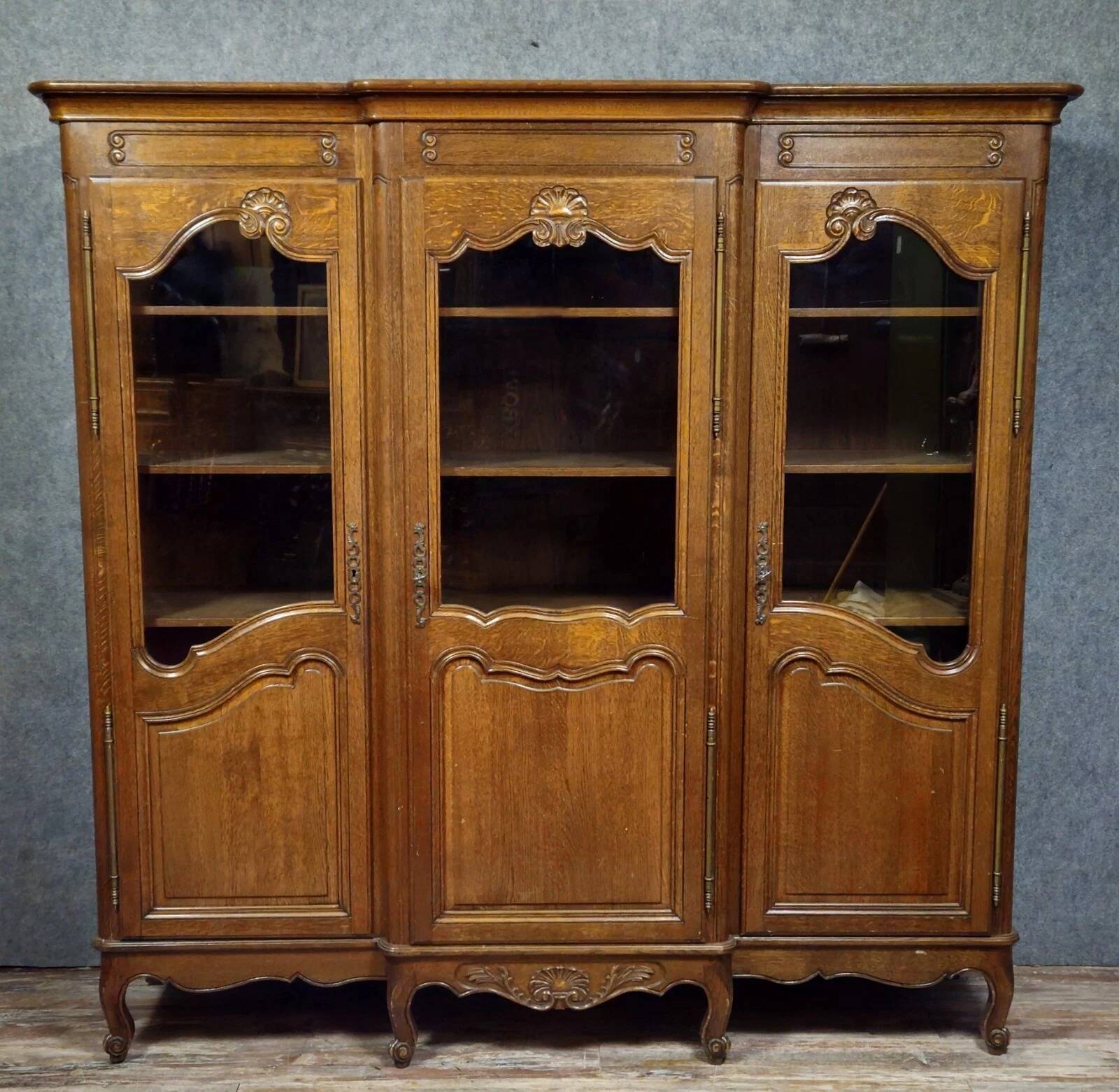 Large Provençal library in Louis XV style made of oak from the 20th century.