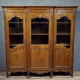 Large Provençal library in Louis XV style made of oak from the 20th century.