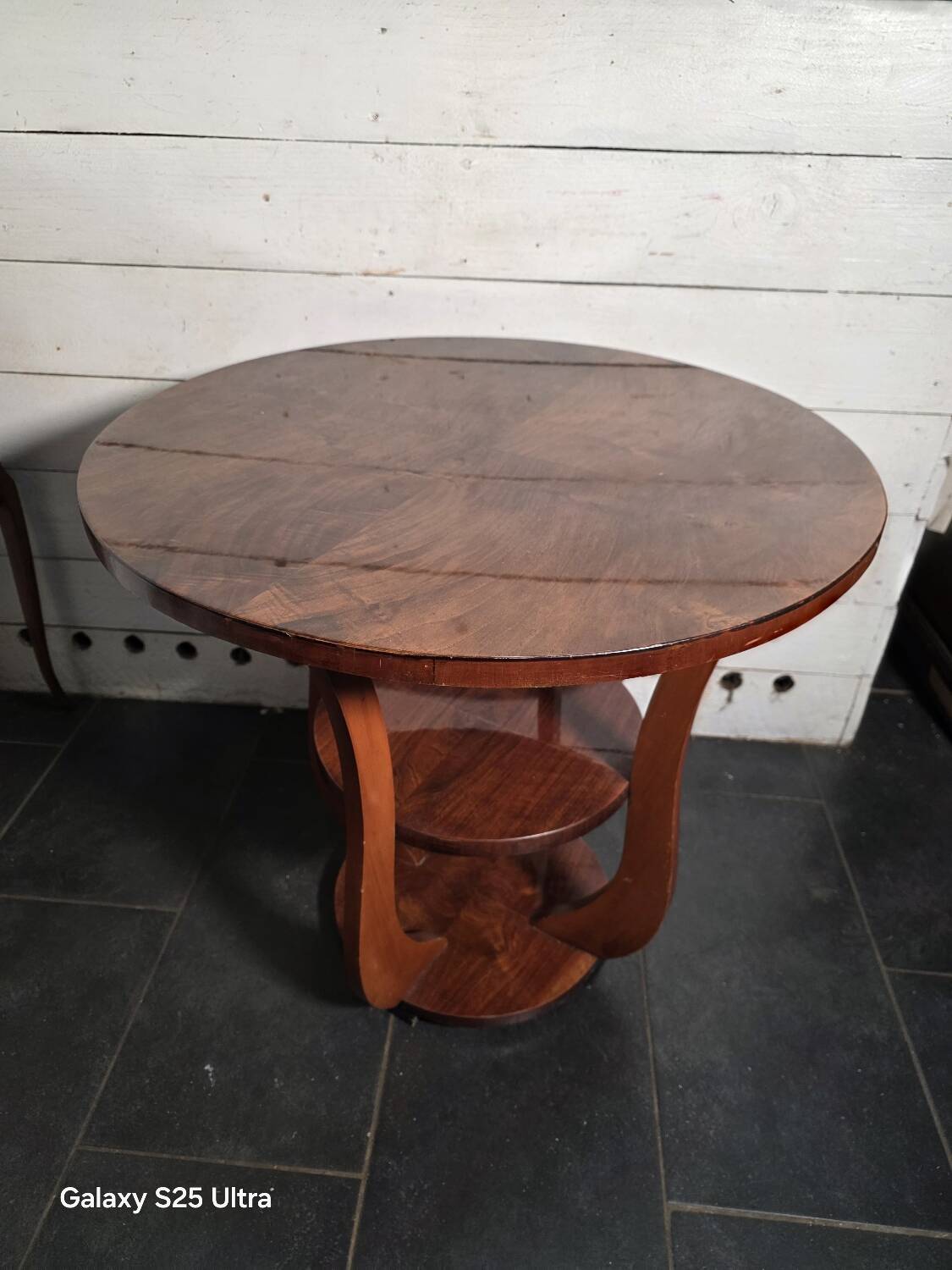 Art Deco walnut gueridon with double top from the 1930s.