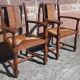 Pair of oak armchairs with straw seats and backs.