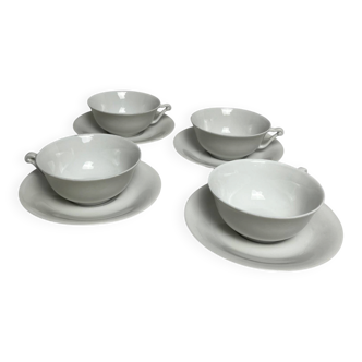 Limoges, four white porcelain tea cups from the 20th century.