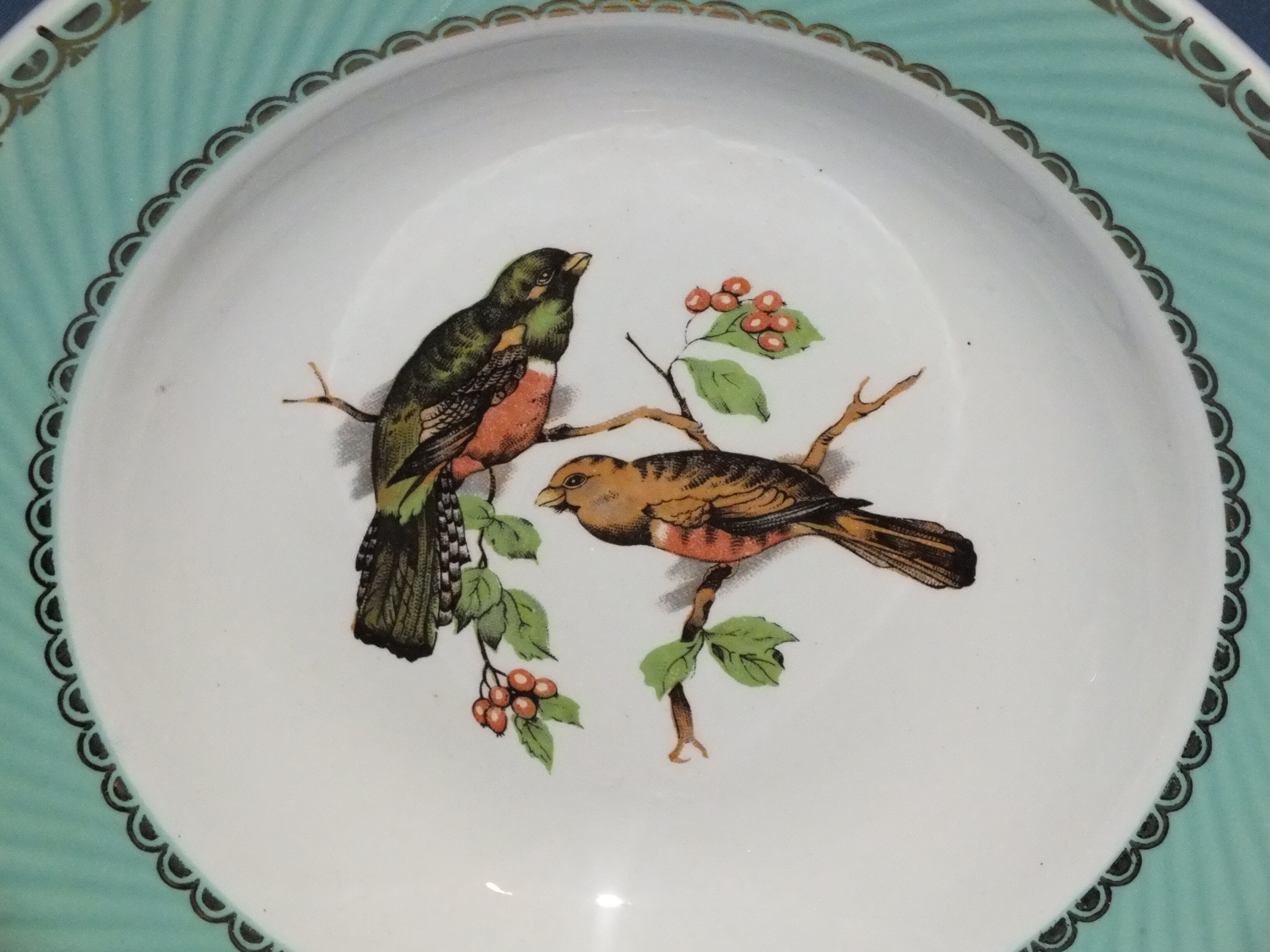 4 vintage hollow plates decorated with birds