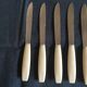 Set of 10 table knives in white Bakelite