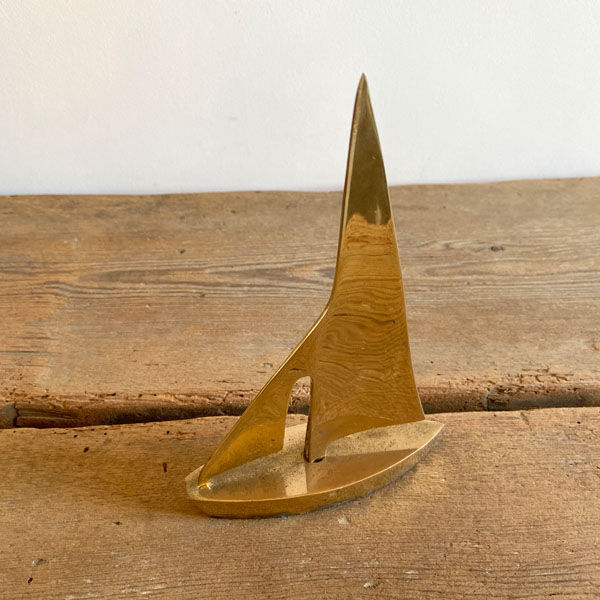 Golden brass sailboat