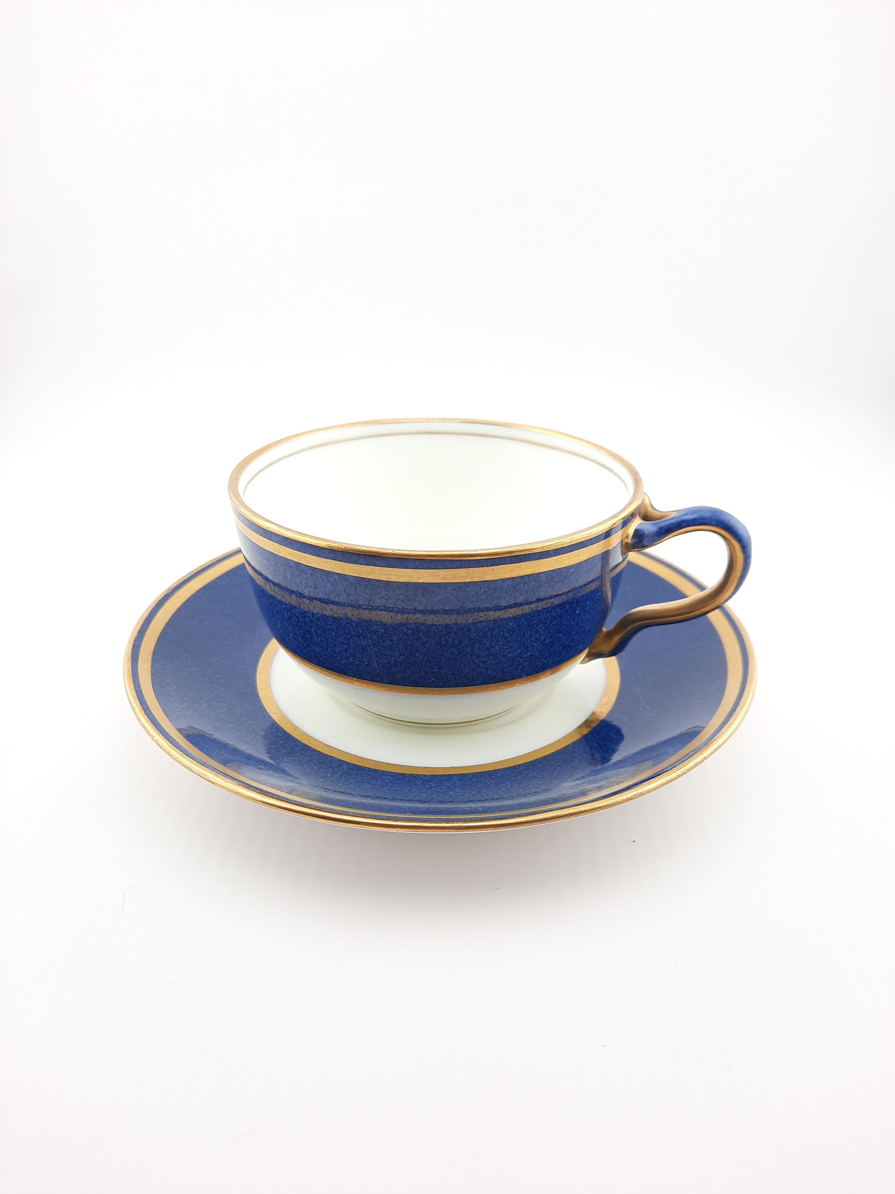 Antique Wedgwood teacup and saucer, bone china. Powder blue and gold English cup and saucer, 1900s