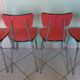 Table in red formica, 4 roc chairs, 2 extension cords, 2 drawers 60