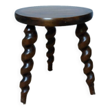 Wooden tripod stool with twisted legs