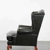 Smooth classic cowhide Chesterfield armchair in a stylish dark green color