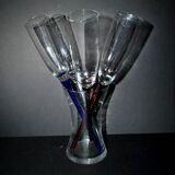 Set of 5 vintage colored glass champagne flutes gathered in a bouquet in a vase