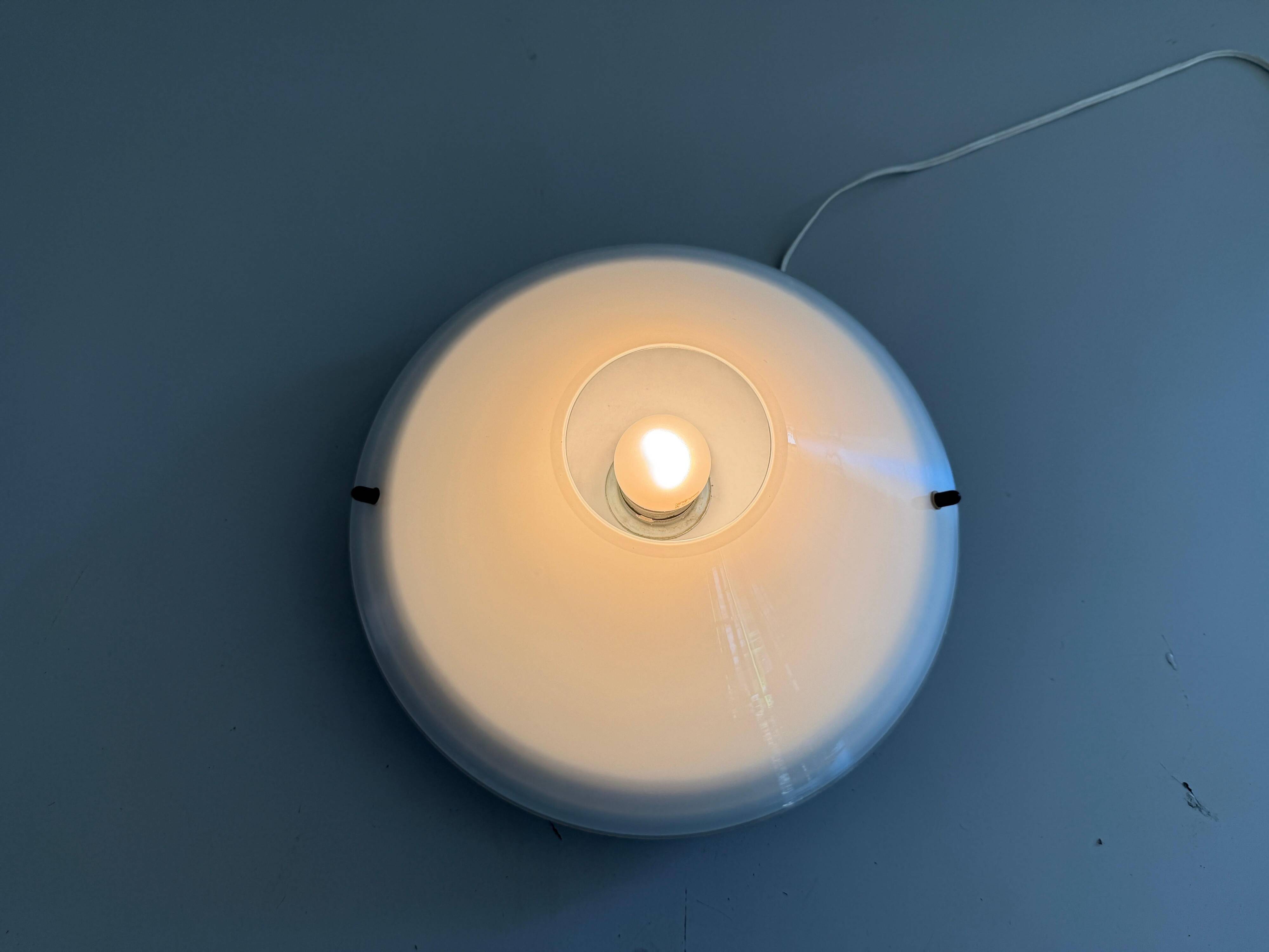 Simple opal glass wall light from the mid-century by Lamperti, 1960s, Italy.