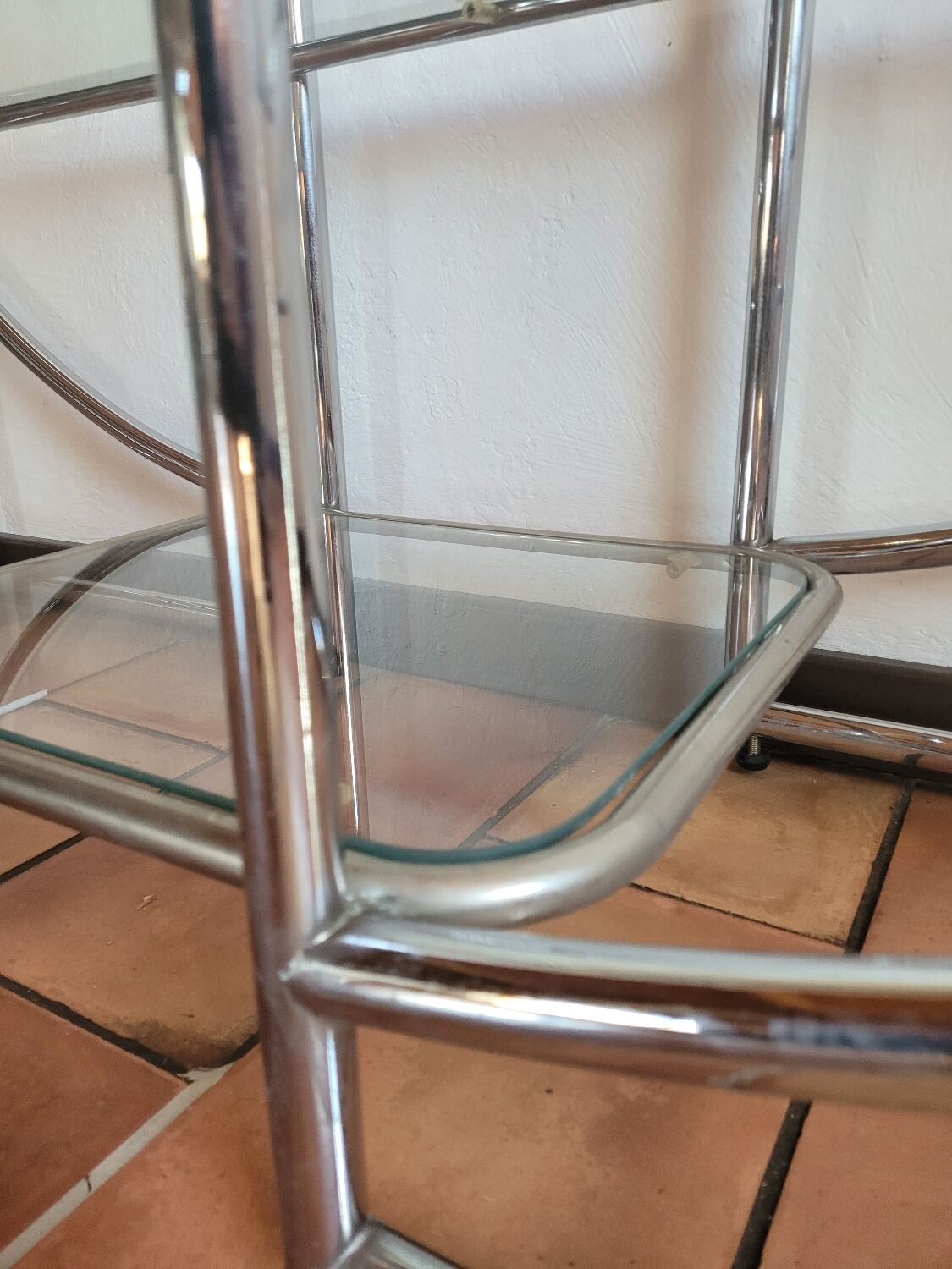Bauhaus-style chrome round shelf