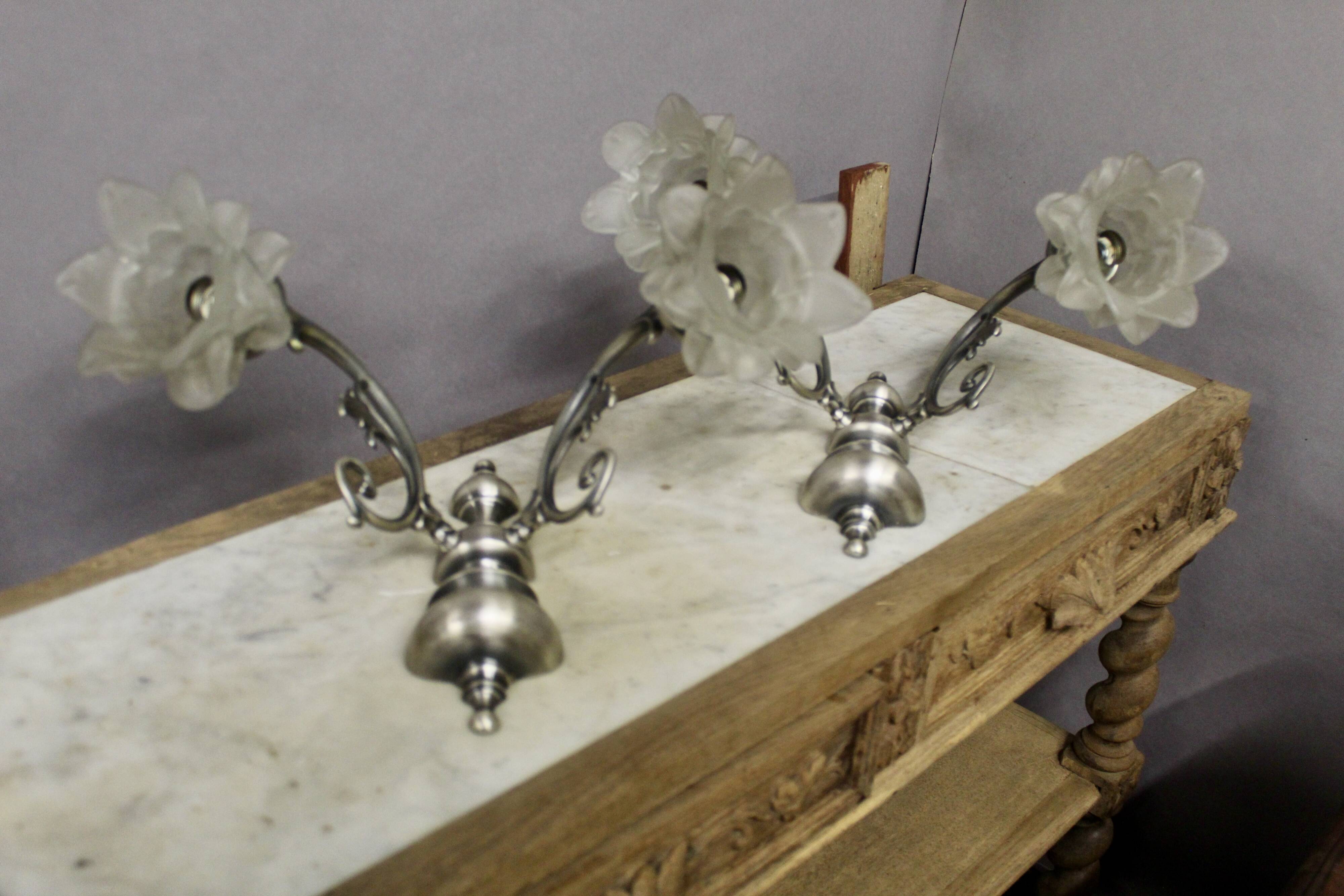Pair of wall sconces with 2 light arms