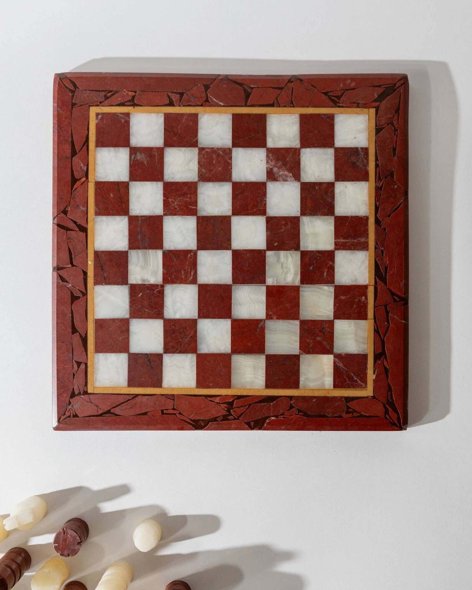 Vintage marble chess set from the 1960s, cream, burgundy and gold board with metal inlay, stone pieces.