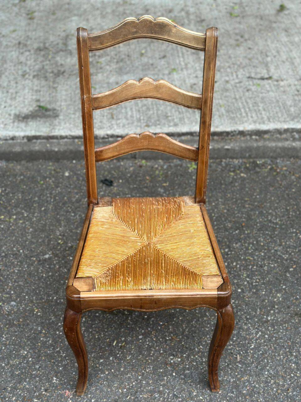 French provincial style chair in solid wood with rush seating.