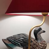 Decorative table lamp with a sculpted duck-shaped base and painted finish.