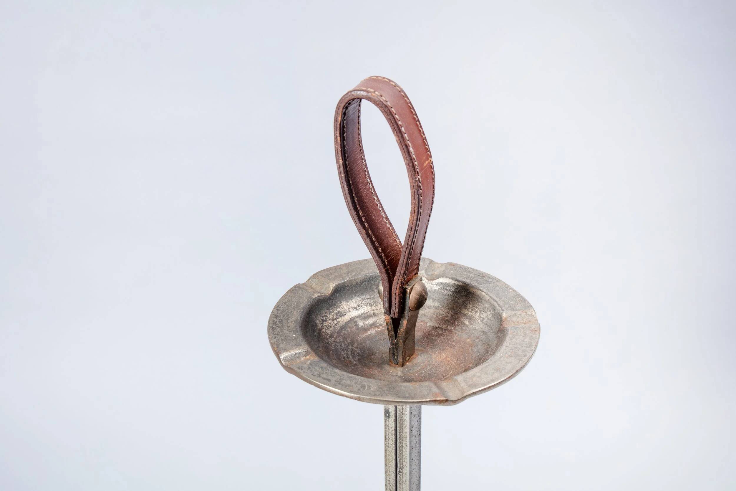 Metal and leather floor ashtray from the 1960s.