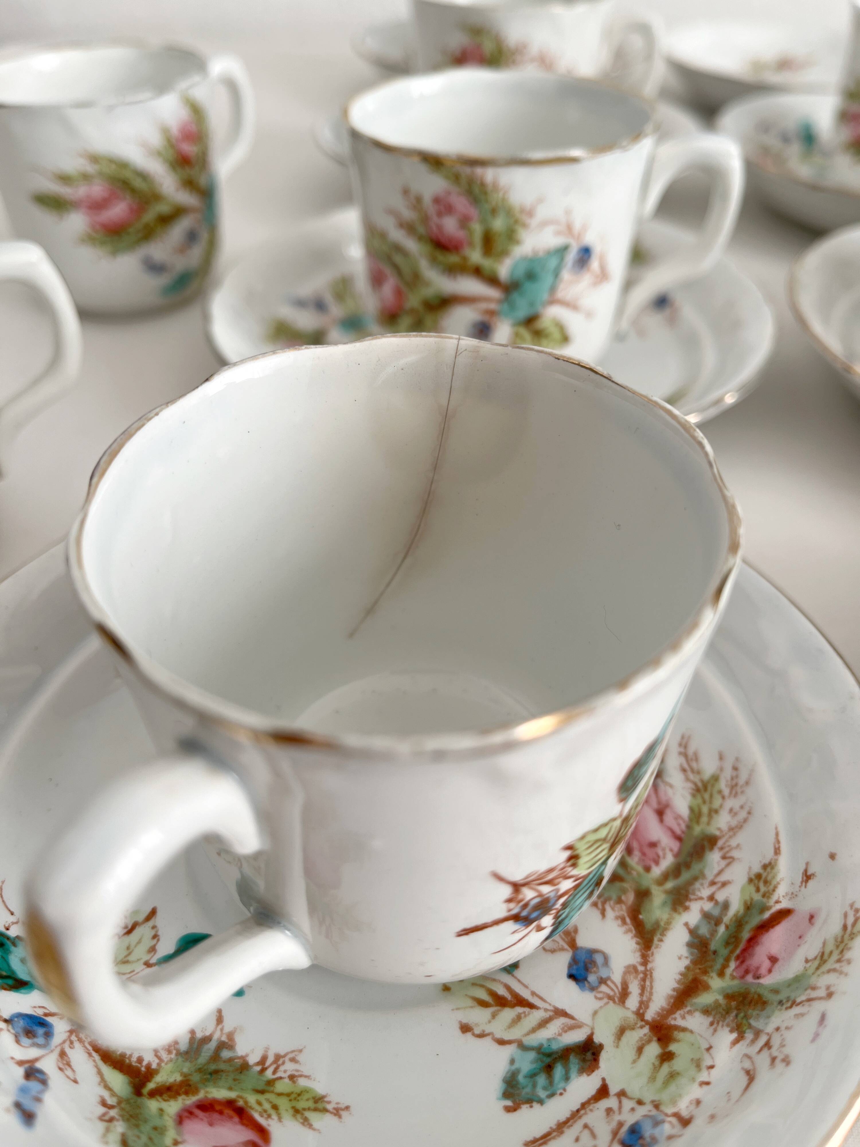 12 ironstone coffee cups with polychrome floral decoration, KG Lunéville