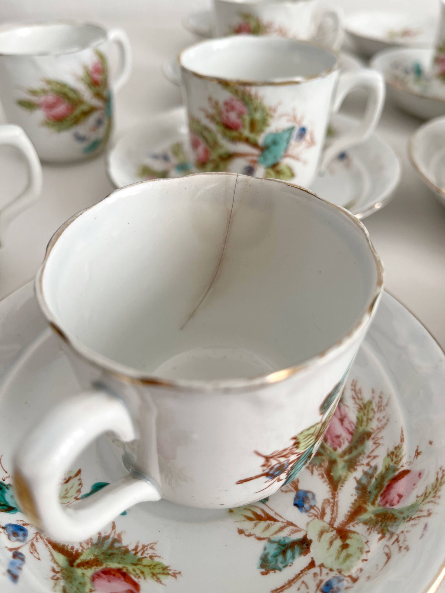 12 ironstone coffee cups with polychrome floral decoration, KG Lunéville