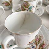 12 ironstone coffee cups with polychrome floral decoration, KG Lunéville