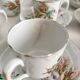 12 ironstone coffee cups with polychrome floral decoration, KG Lunéville