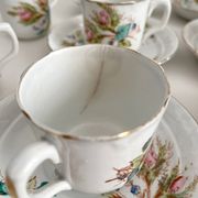 12 ironstone coffee cups with polychrome floral decoration, KG Lunéville