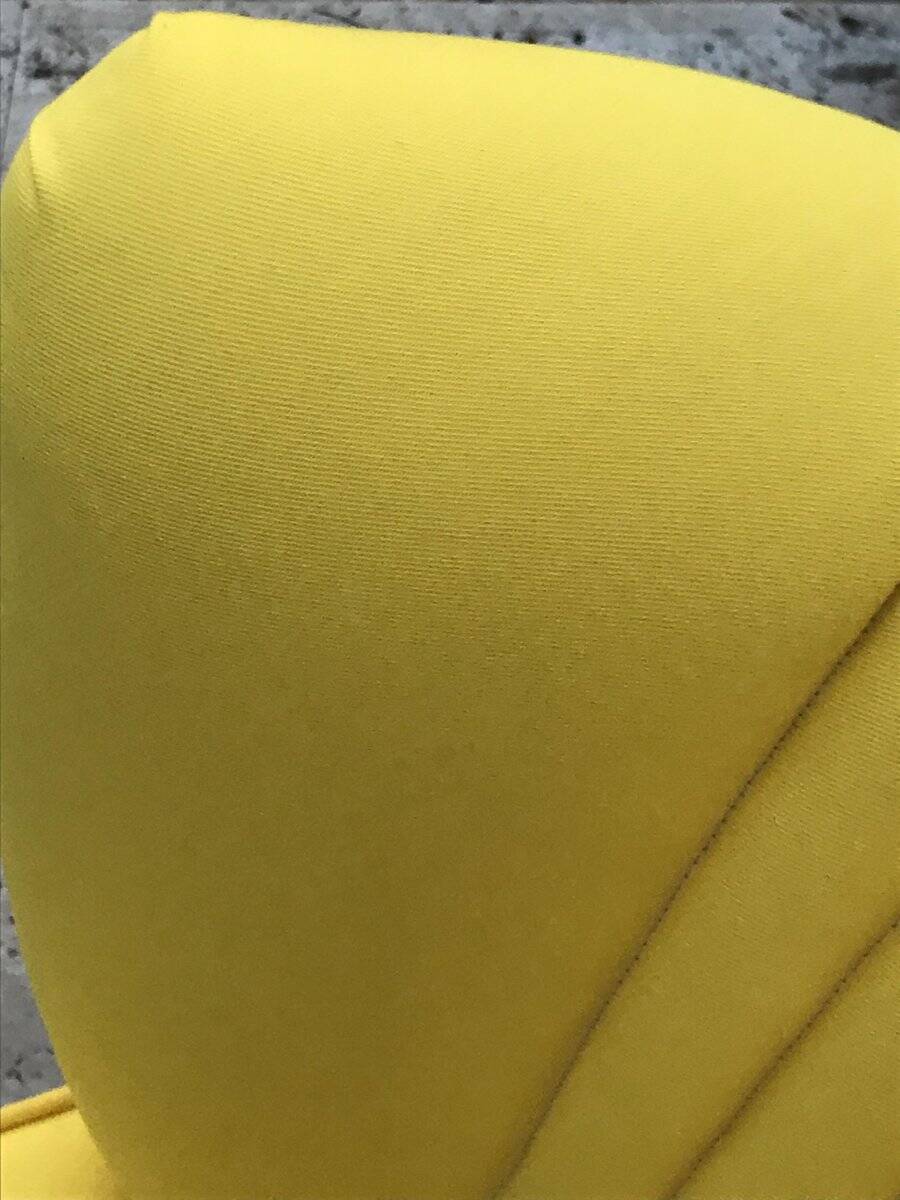 Yellow cocktail chair in solid beech, 1960s, with fluted backrest and tapered legs.