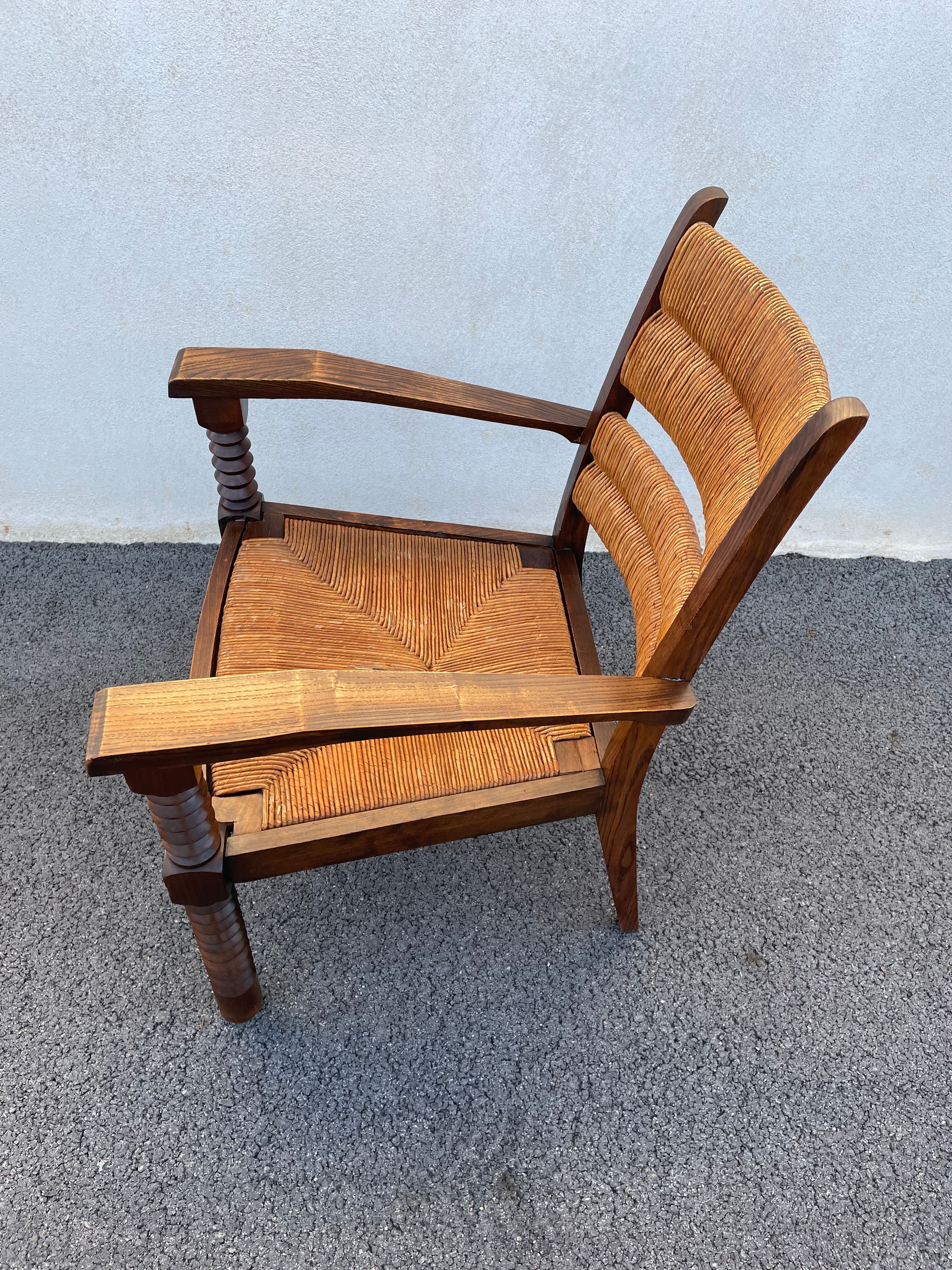 Vintage armchair in straw and brutalist wood