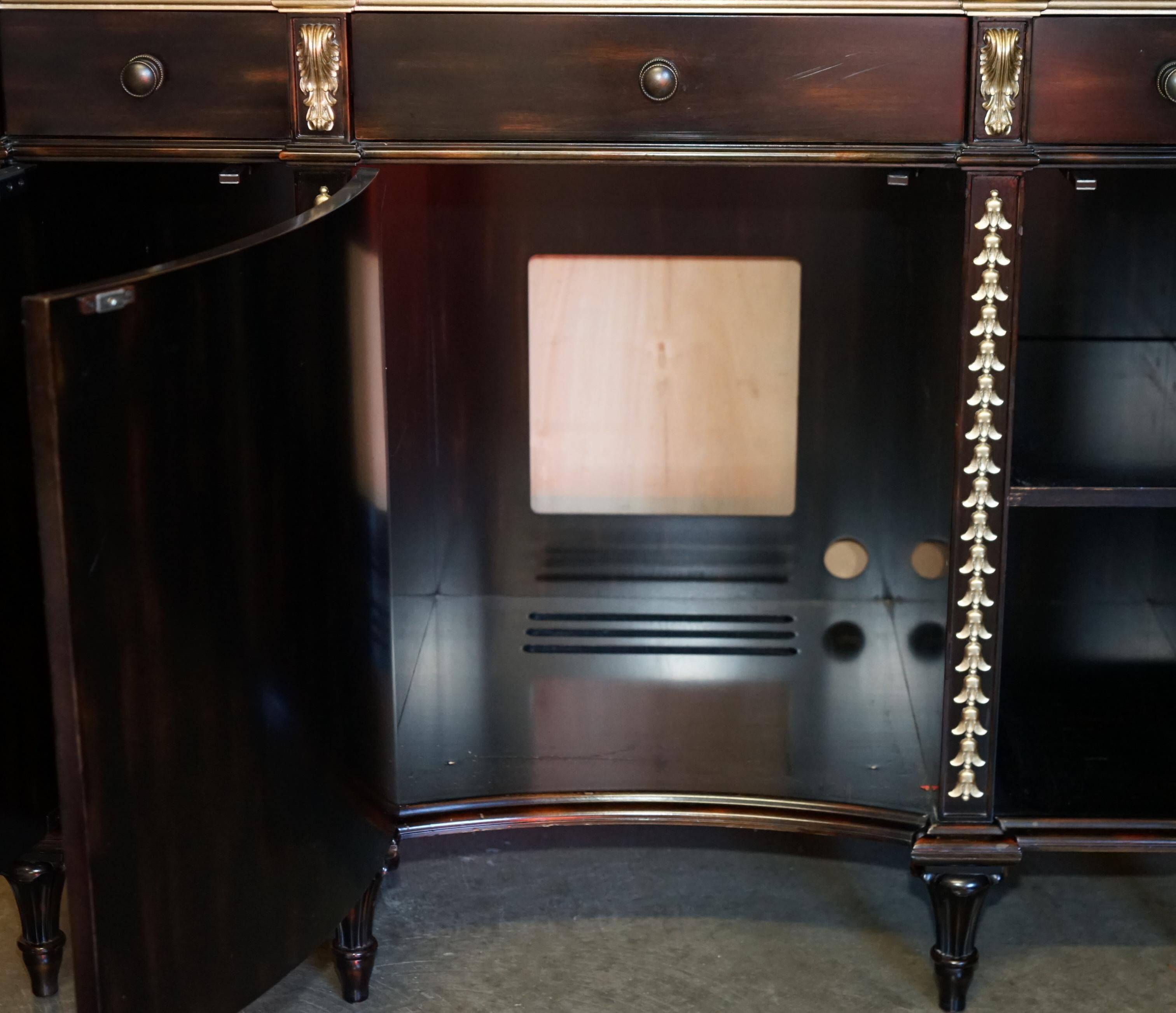 Contemporary Chinese buffet with a marble top and space for a mini-fridge.