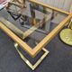 Vintage brass and smoked glass console.