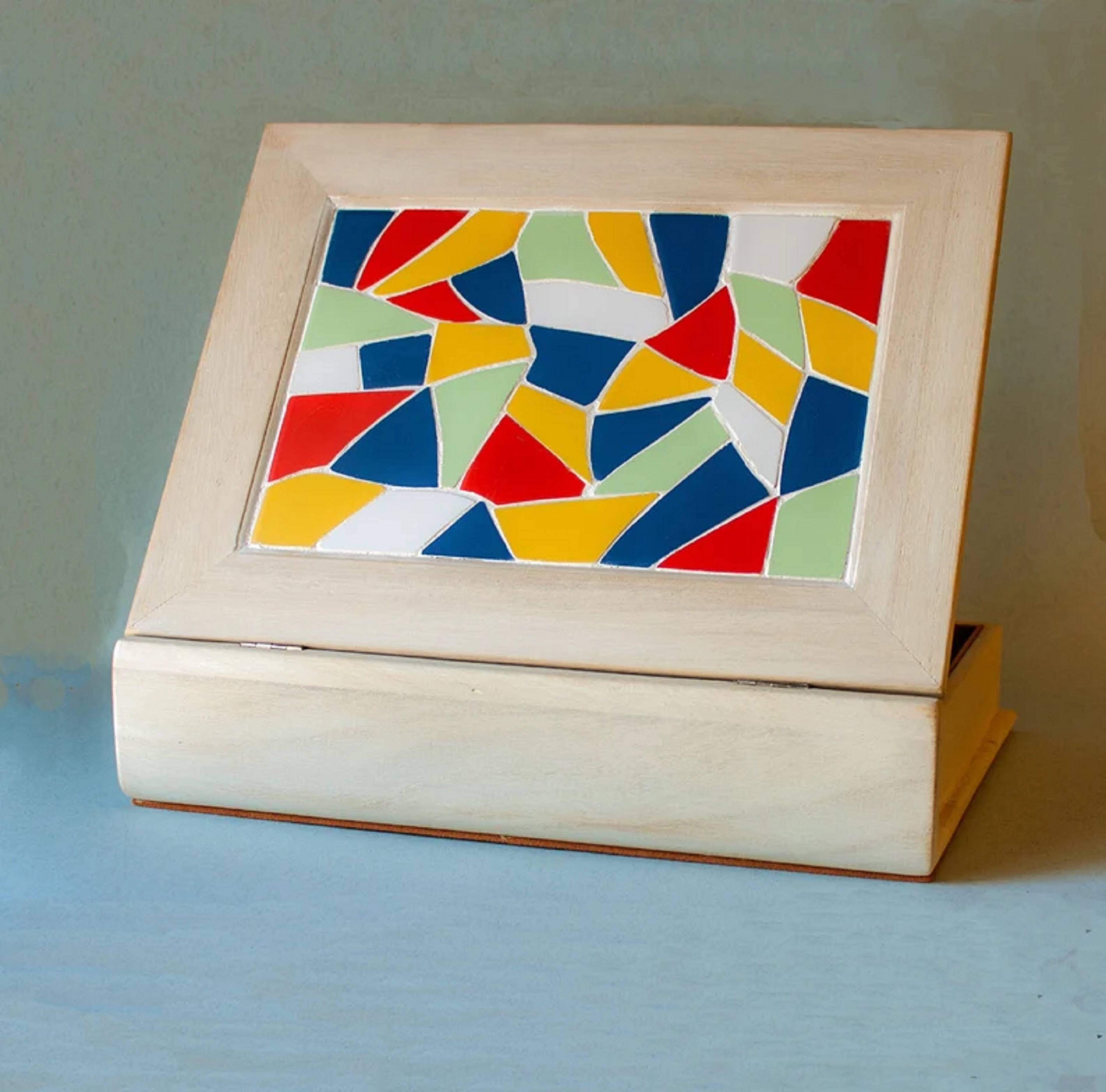 White wooden boxes decorated with Catalan trencadís style mosaics