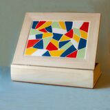 White wooden boxes decorated with Catalan trencadís style mosaics