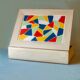 White wooden boxes decorated with Catalan trencadís style mosaics