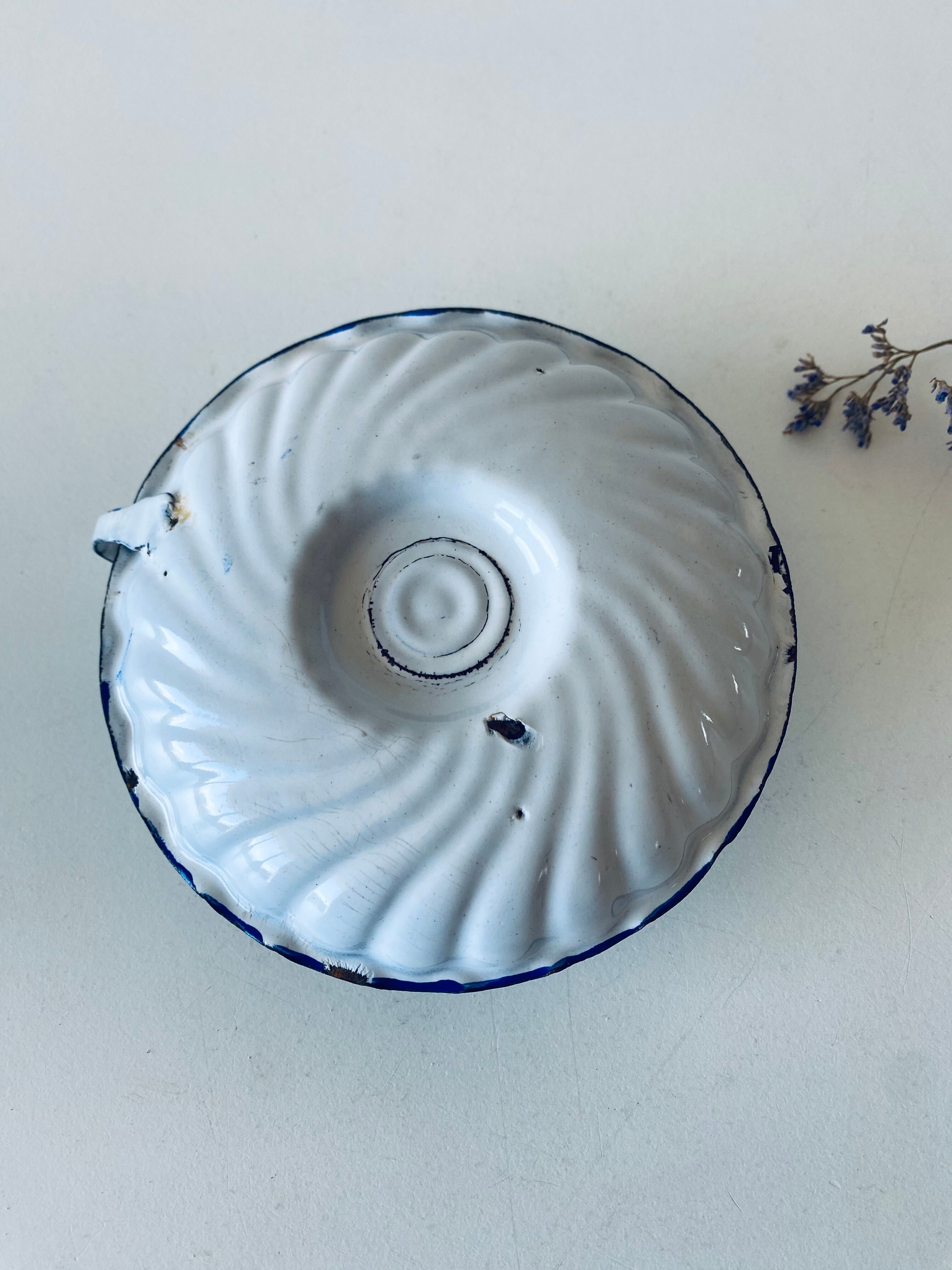 Antique candle holder in white and blue enamelled metal