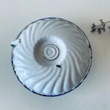 Antique candle holder in white and blue enamelled metal