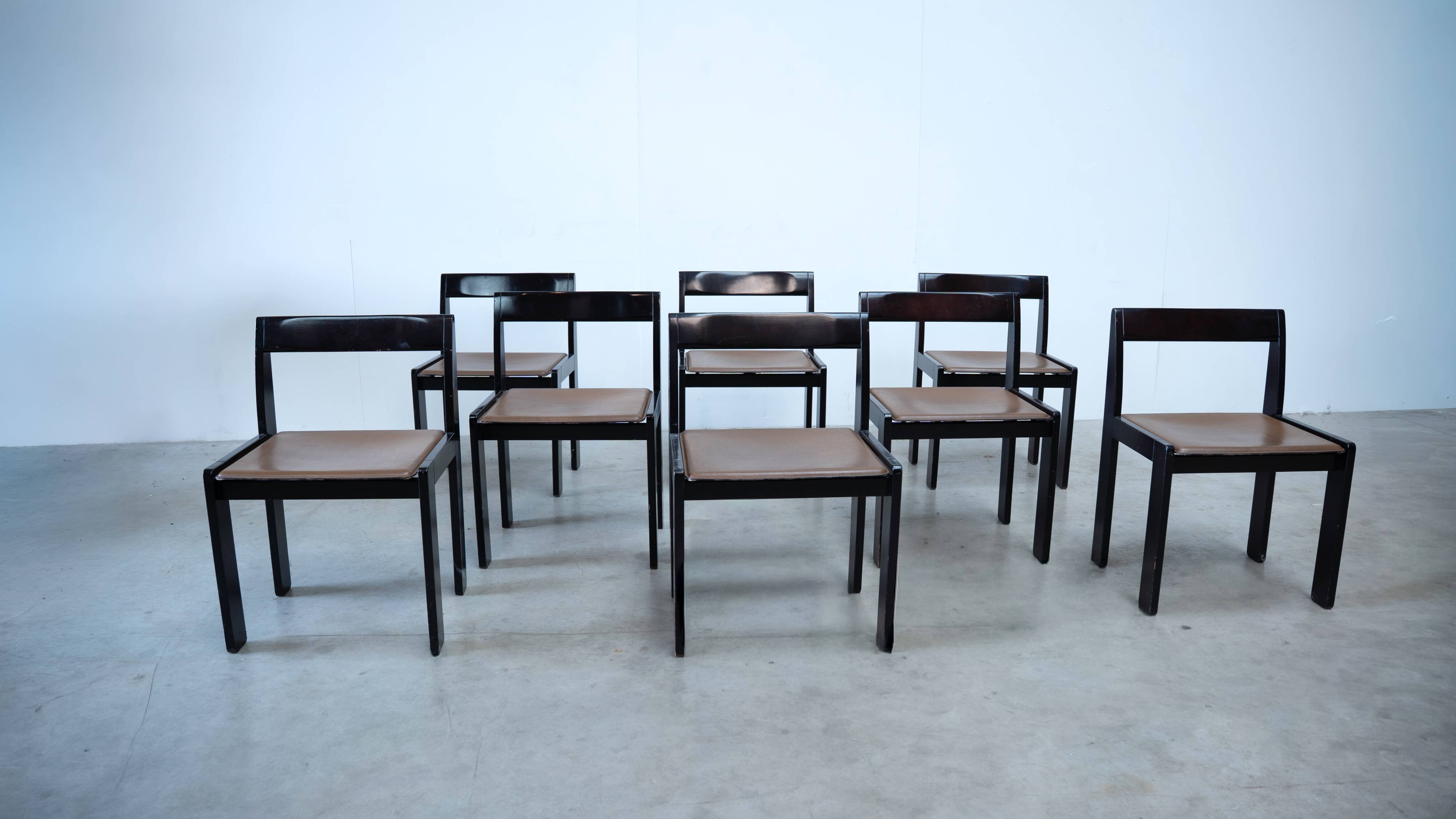Set of eight black lacquered dining chairs