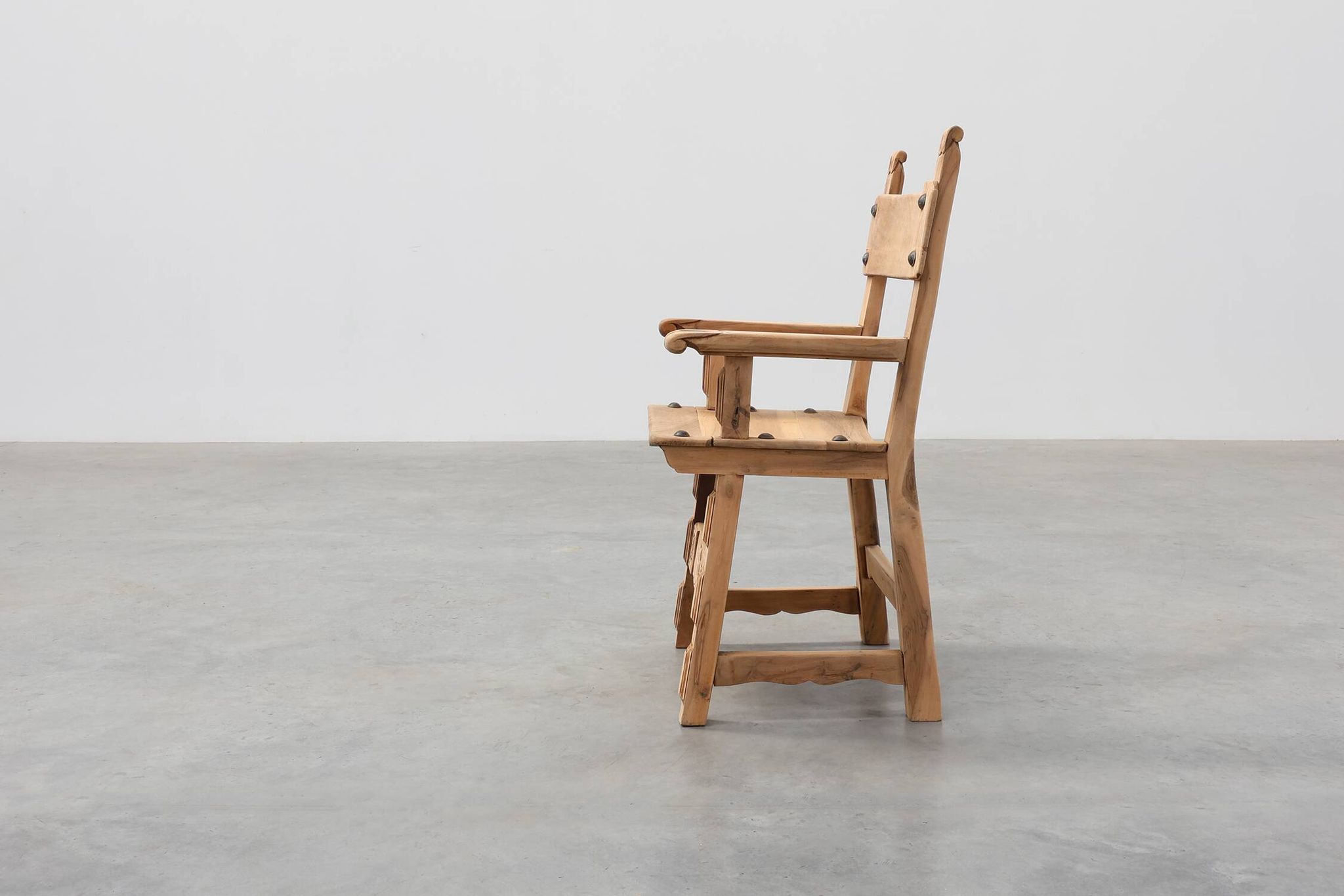 Brutalist armchair with carved rosettes and nailed wooden seat, Spain, 20th