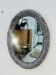 Vintage oval wicker mirror from the 1960s.